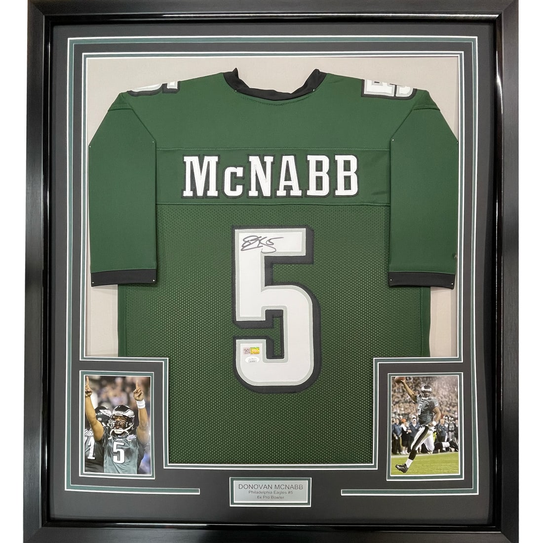 Framed Donovan McNabb signed Eagles jersey BAS COA 33x42: Framed Donovan McNabb signed Eagles jersey BAS COA 33x42 This professionally framed and matted Philadelphia Eagles green jersey features the autograph of Donovan McNabb. The display includes two 8x10 