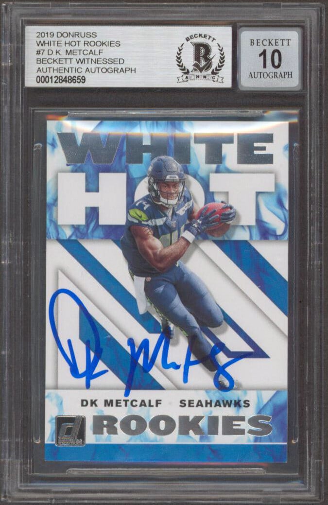 2019 Donruss White Hot Rookies #7 D.K. Metcalf Autographed Card BAS 10: 2019 Donruss White Hot Rookies #7 D.K. Metcalf Autographed Card BAS 10 2019 Donruss White Hot Rookies #7 rookie card personally signed by D.K. Metcalf of the Seattle Seahawks. The card is slabbed and 