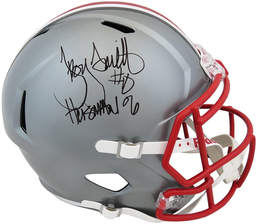 Troy Smith Signed Ohio State FLASH Helmet Heisman 06 with COA: Troy Smith Signed Ohio State FLASH Helmet Heisman 06 with COA This is a full-size replica helmet of the Ohio State Buckeyes, signed by Troy Smith, featuring the inscription 'Heisman 06'. The helmet, c
