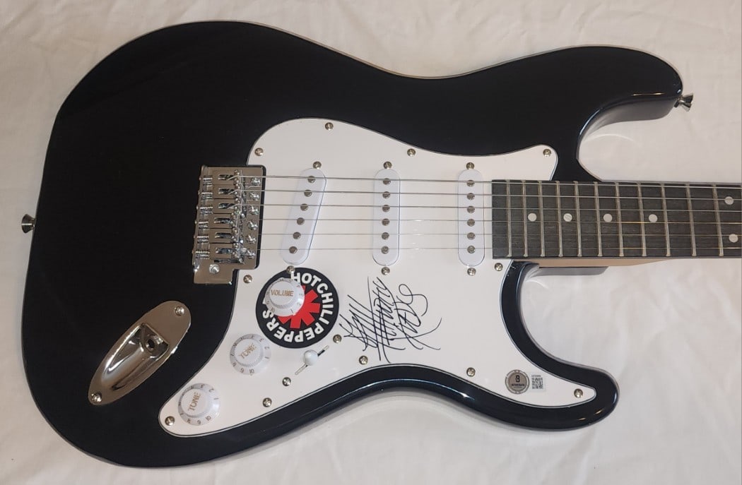 Beckett Authenticated Anthony Kiedis Signed Electric Guitar: Beckett Authenticated Anthony Kiedis Signed Electric Guitar This electric guitar and guitar pick are autographed by Anthony Kiedis of the Red Hot Chili Peppers. The item is authenticated by Beckett Au