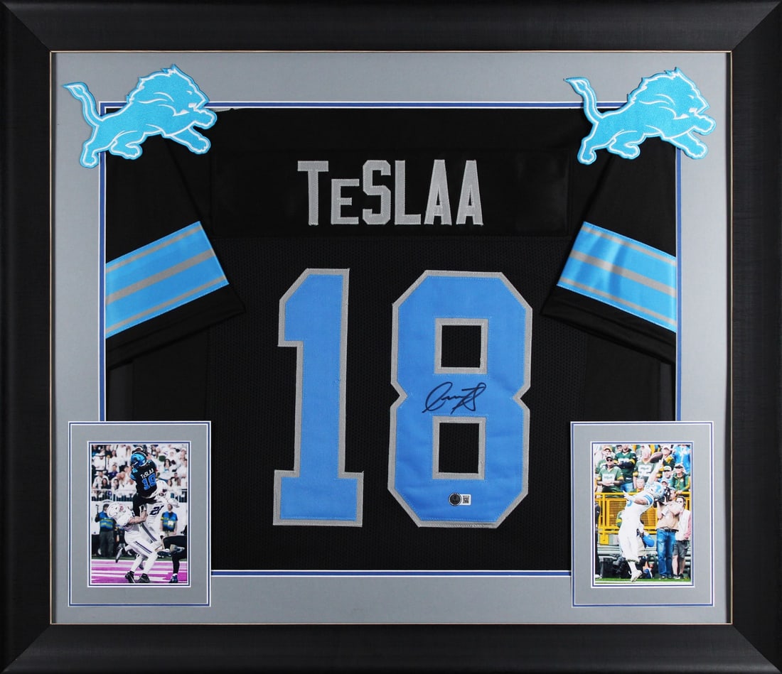 Framed Detroit Lions Black Jersey Signed by Isaac TeSlaa BAS Witnessed: Framed Detroit Lions Black Jersey Signed by Isaac TeSlaa BAS Witnessed This professionally framed black Pro Style jersey has been personally signed by Isaac TeSlaa of the Detroit Lions. The jersey is 