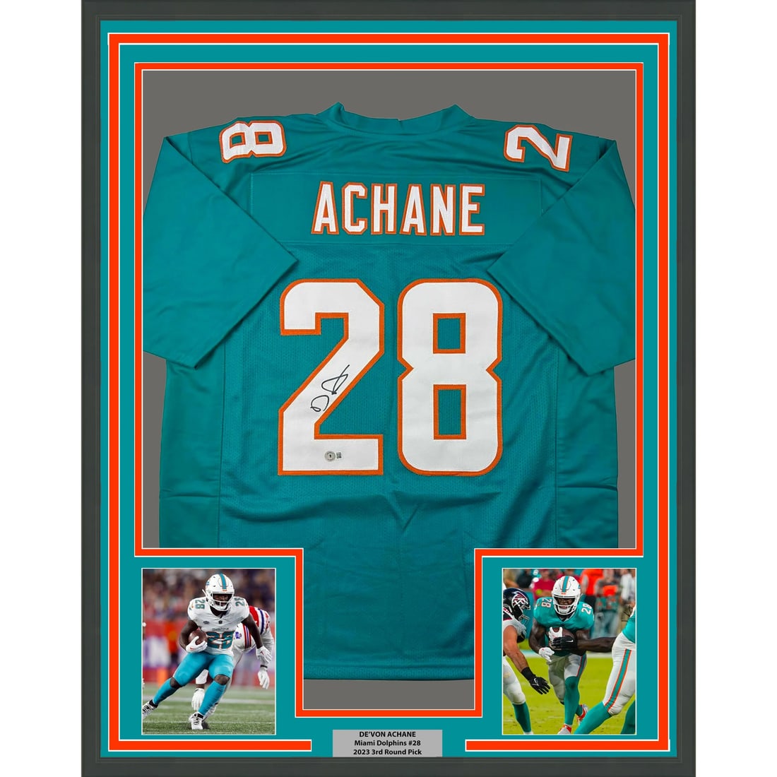 De'Von Achane Framed Signed Miami Dolphins Teal Jersey BAS COA: De'Von Achane Framed Signed Miami Dolphins Teal Jersey BAS COA This framed Miami Dolphins jersey is autographed by De'Von Achane. The jersey is professionally framed and matted, featuring two 5x7 phot