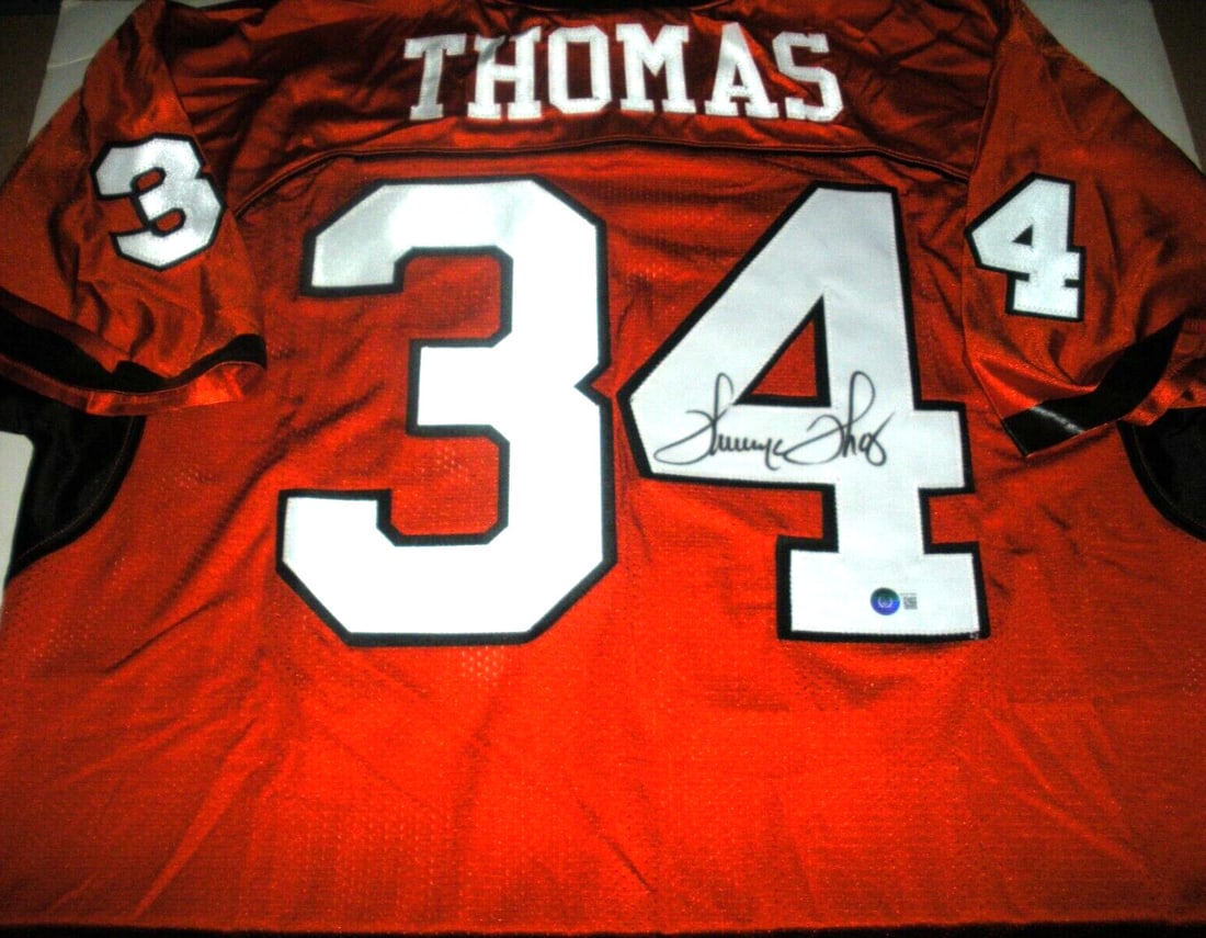 Thurman Thomas Oklahoma Signed Russell Jersey with COA: Thurman Thomas Oklahoma Signed Russell Jersey with COA This official licensed Russell jersey is signed by Thurman Thomas, the legendary NFL player from Oklahoma. It is an original piece and comes with