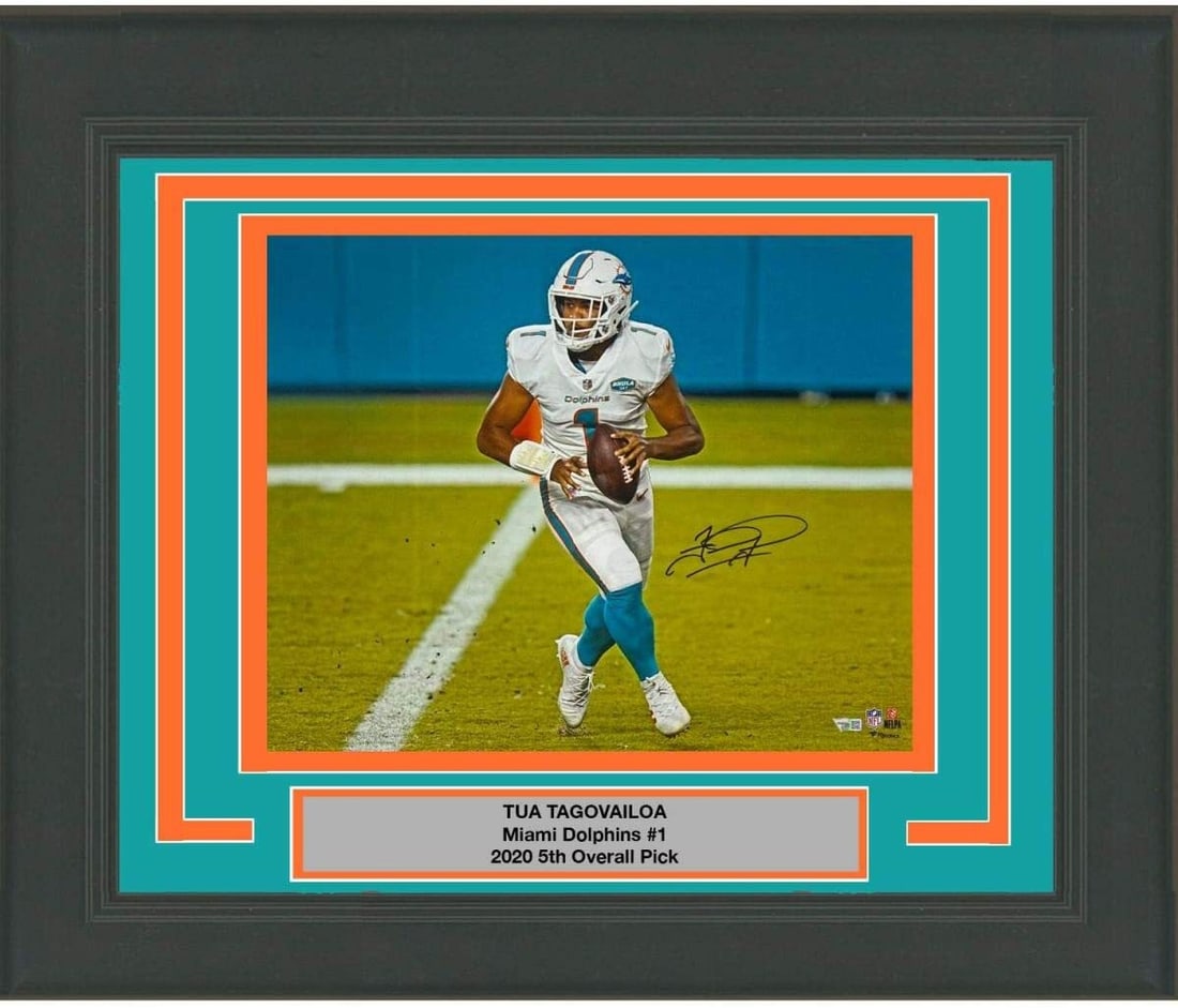 Framed Autographed Tua Tagovailoa 16x20 Photo Miami Dolphins Fanatics COA: Framed Autographed Tua Tagovailoa 16x20 Photo Miami Dolphins Fanatics COA Celebrate the legacy of Tua Tagovailoa with this professionally framed and matted 16x20 photo, showcasing his remarkable talen