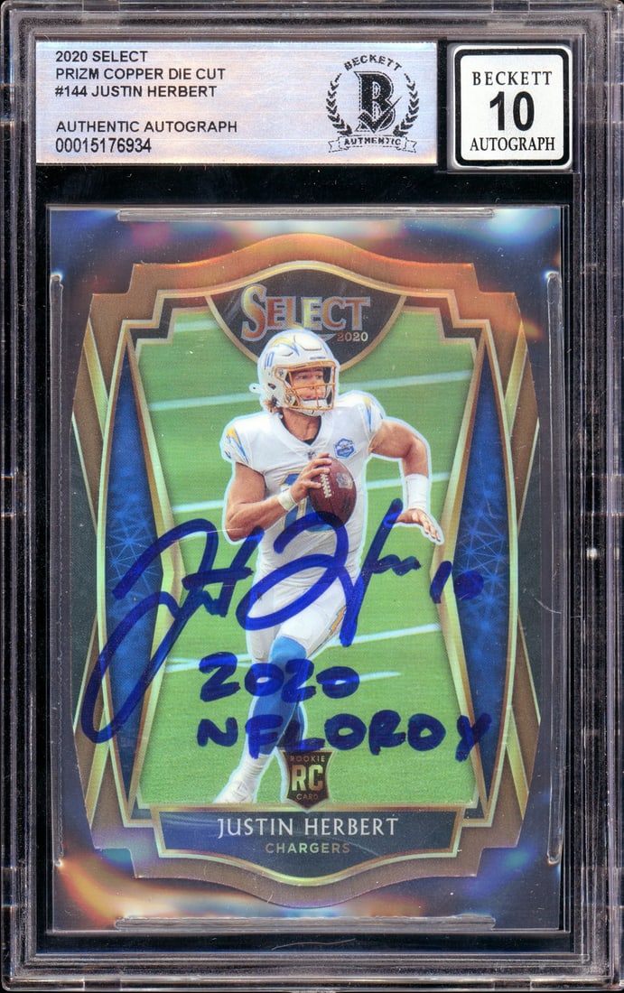 Justin Herbert 2020 Select Prizm Copper Die-Cut Rookie Auto Serial 348 of 355 BGS: Justin Herbert 2020 Select Prizm Copper Die-Cut Rookie Auto Serial 348 of 355 BGS This is a 2020 Panini Select Prizm Copper Die-Cut Justin Herbert rookie card, numbered #144. The card is hand-signed b
