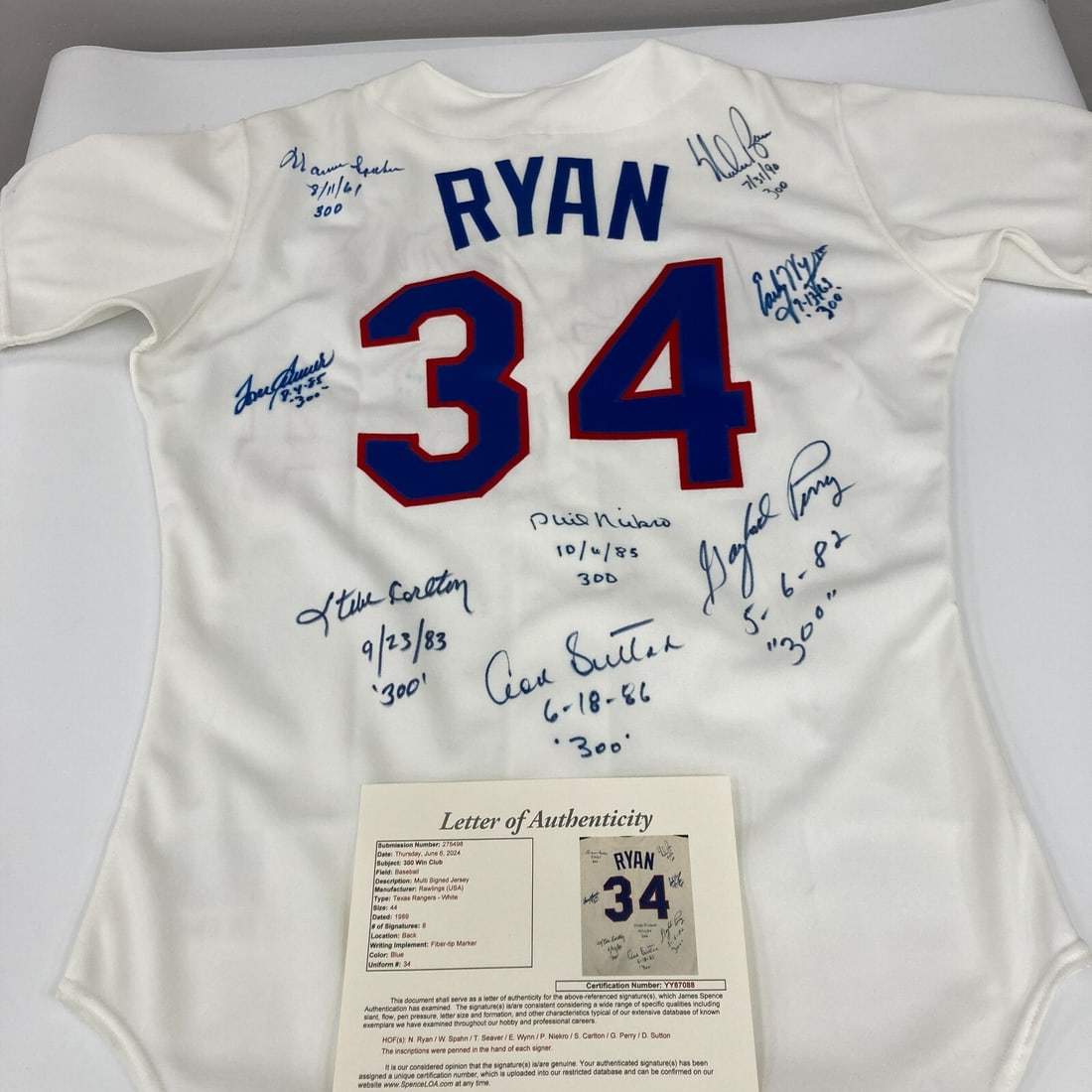 300 Win Club Multi Signed Nolan Ryan Jersey with JSA COA: 300 Win Club Multi Signed Nolan Ryan Jersey with JSA COA This stunning 300 Win Club multi-signed jersey features the legendary Nolan Ryan and is a must-have for any baseball enthusiast. The jersey, a 