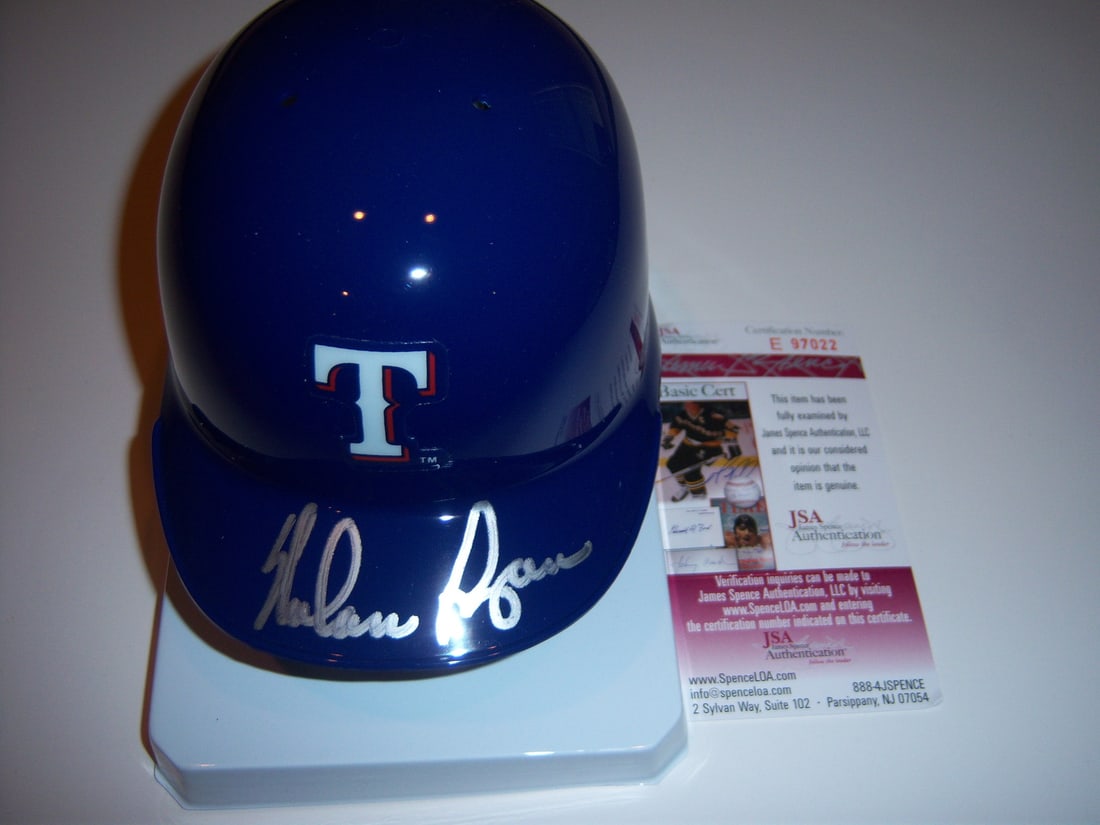 Nolan Ryan Autographed Mini Helmet JSA COA Texas Rangers New York Mets HOF 1999: Nolan Ryan Autographed Mini Helmet JSA COA Texas Rangers New York Mets HOF 1999 This is a pre-owned mini helmet signed by Nolan Ryan, representing the Texas Rangers and New York Mets. The helmet is an