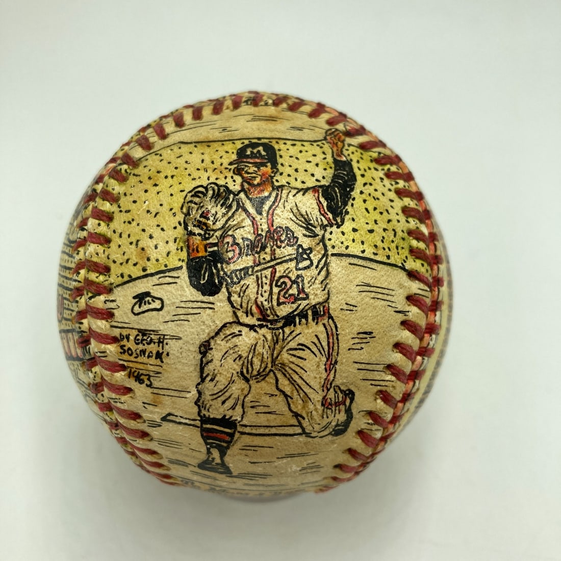 Warren Spahn Signed Folk Art Baseball by George Sosnak: Warren Spahn Signed Folk Art Baseball by George Sosnak This unique piece features a hand-painted baseball by George Sosnak, showcasing the artistic talent and love for the game. Signed by Hall of Fame