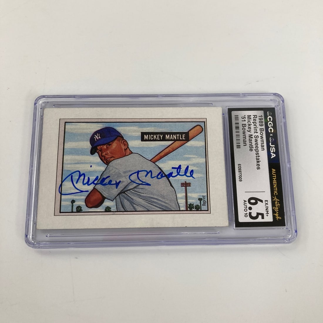 Mickey Mantle autographed 1989 Bowman card CGC graded 6.5: Mickey Mantle autographed 1989 Bowman card CGC graded 6.5 This is a Mickey Mantle signed sports trading card from the 1989 Bowman set, featuring the 1951 Bowman rookie card design. The card has been p