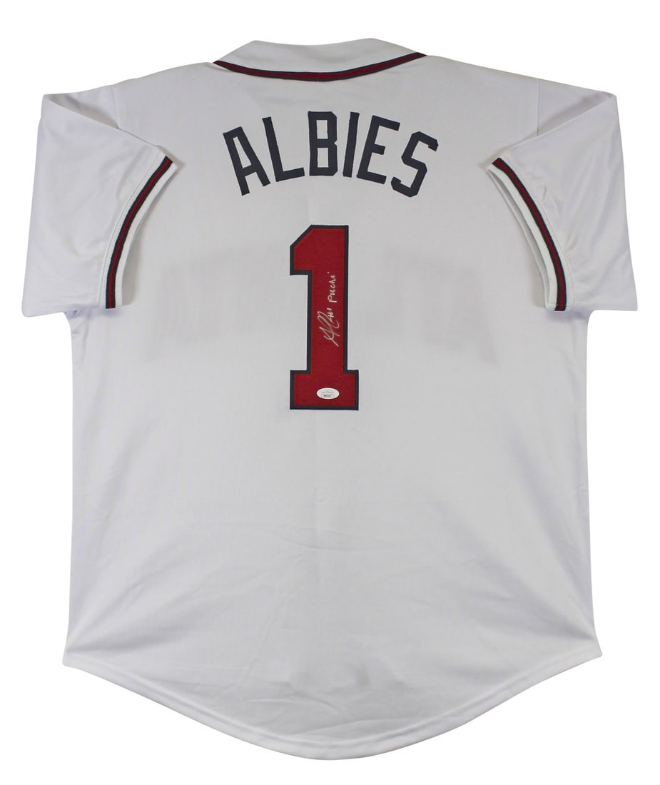 Ozzie Albies Signed White Jersey with Puchi Inscription JSA Certified: Ozzie Albies Signed White Jersey with Puchi Inscription JSA Certified This authentic signed white pro style jersey is a must-have for any Atlanta Braves fan. Personally autographed by Ozzie Albies, th