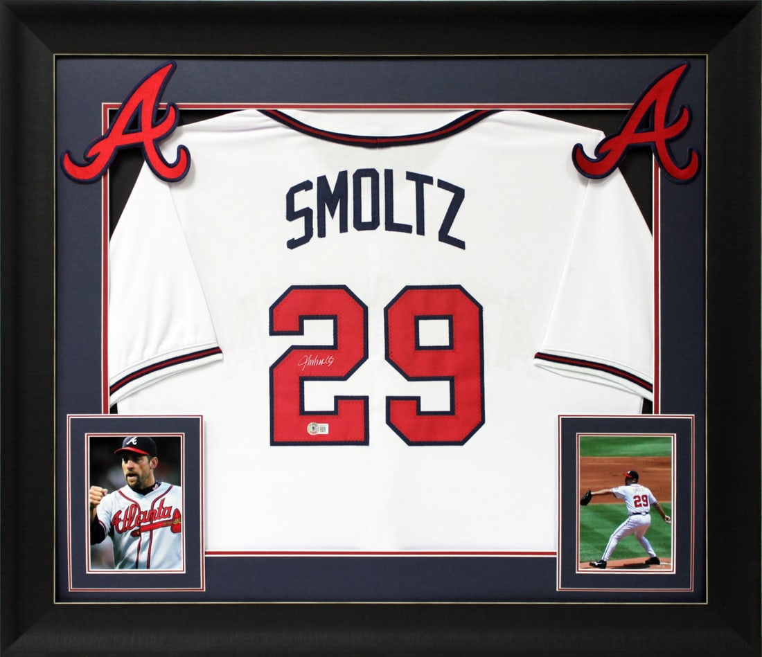 Framed White Jersey Signed by John Smoltz with Silver Autograph BAS Witness: Framed White Jersey Signed by John Smoltz with Silver Autograph BAS Witness This professionally framed white pro style jersey features the authentic silver signature of John Smoltz of the Atlanta Brav