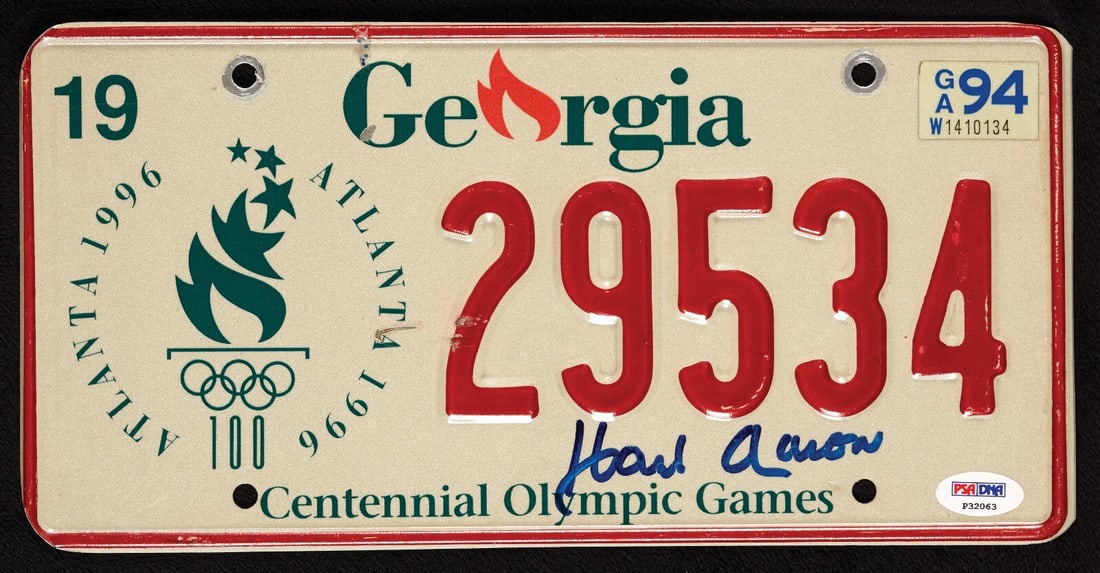 Hank Aaron Signed 1996 Olympics Georgia License Plate PSA DNA: Hank Aaron Signed 1996 Olympics Georgia License Plate PSA DNA Celebrate the legacy of baseball legend Hank Aaron with this autographed Georgia 1996 Olympics license plate. This original item features 