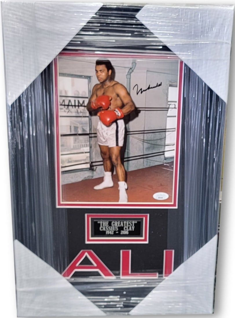 Framed Muhammad Ali signed boxing photo JSA letter 13 x 20: Framed Muhammad Ali signed boxing photo JSA letter 13 x 20 This is a custom framed photo hand signed by Muhammad Ali, the legendary boxing champion. The autograph has been authenticated by James Spenc