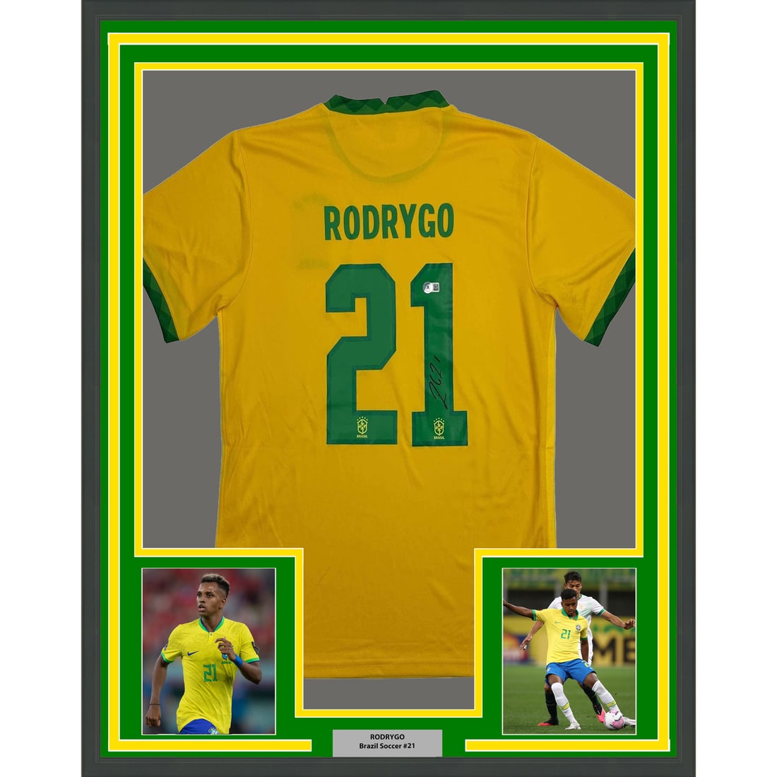 Rodrygo Signed Brazil Jersey With Photos Framed 35x39 Beckett Authenticated: Rodrygo Signed Brazil Jersey With Photos Framed 35x39 Beckett Authenticated This professionally framed and matted display features a Brazil jersey autographed by Rodrygo Silva de Goes. The jersey come