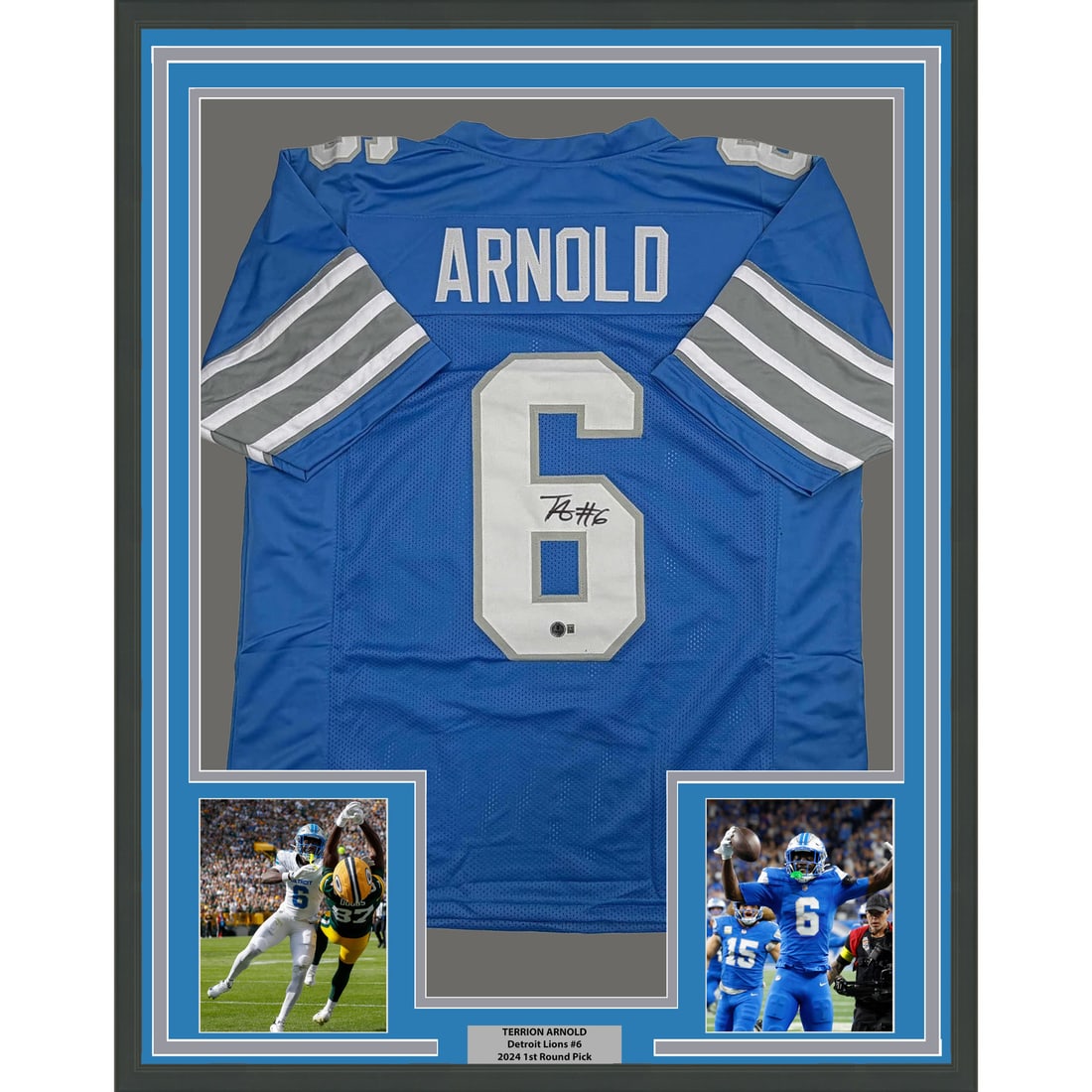 Terrion Arnold Signed Detroit Lions Jersey in 35x39 Frame with Beckett COA: Terrion Arnold Signed Detroit Lions Jersey in 35x39 Frame with Beckett COA This professionally framed display features a Detroit Lions blue jersey autographed by Terrion Arnold. The frame includes two