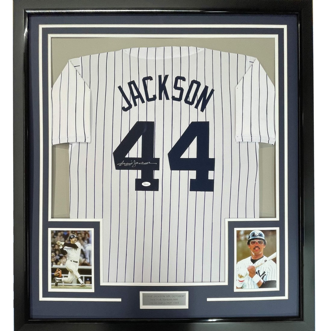 Framed JSA Authenticated Reggie Jackson New York Yankees Pinstripe Jersey: Framed JSA Authenticated Reggie Jackson New York Yankees Pinstripe Jersey This framed autographed jersey features the iconic Reggie Jackson, a legendary player for the New York Yankees. The jersey is 