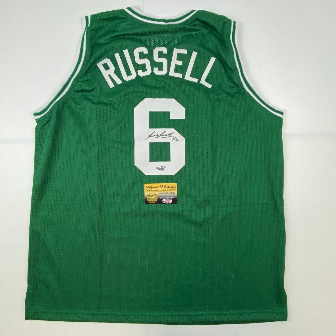 Bill Russell signed Boston Celtics green XL jersey JSA COA: Bill Russell signed Boston Celtics green XL jersey JSA COA This is a custom Boston Celtics green jersey autographed by basketball legend Bill Russell. The jersey is intended as a collectible and is no