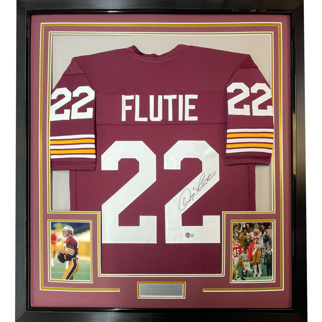 Framed Doug Flutie Autographed Boston College Jersey with BAS COA: Framed Doug Flutie Autographed Boston College Jersey with BAS COA This stunning framed jersey features the autograph of Doug Flutie, a legendary player for the Boston College Eagles. The maroon jersey
