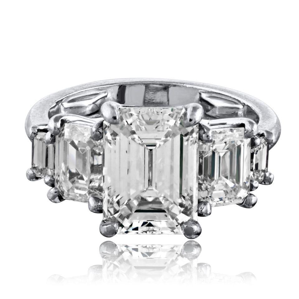 Platinum GIA Emerald Cut Diamond Five Stone Ring Size 5: Platinum GIA Emerald Cut Diamond Five Stone Ring Size 5 This platinum five-stone engagement ring features a center emerald cut diamond weighing 3.50 carats with GIA certification, J color, and VS1 cla
