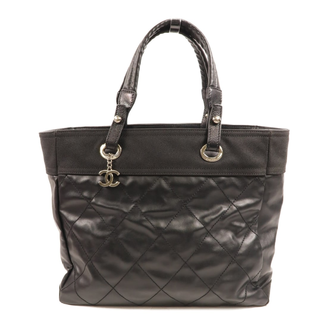 CHANEL Paris Biarritz Black Coated Canvas Tote Bag: CHANEL Paris Biarritz Black Coated Canvas Tote Bag CHANEL Paris Biarritz tote handbag in black PVC coated canvas with the signature CC design. This women's tote bag is made in France and is described 