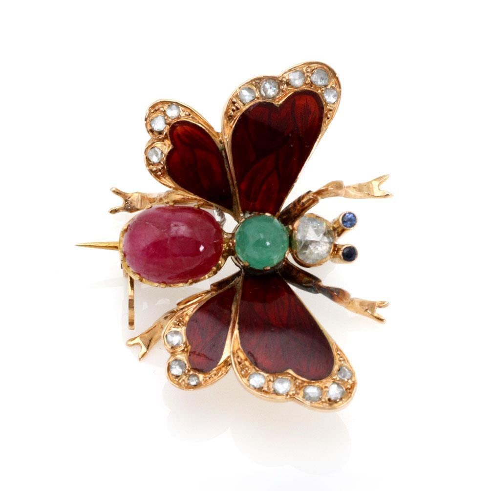 Antique 18k Yellow Gold Butterfly Brooch with Ruby Emerald Diamonds: Antique 18k Yellow Gold Butterfly Brooch with Ruby Emerald Diamonds This exquisite antique butterfly brooch is meticulously crafted from 18k yellow gold, showcasing its original patina. The brooch fea