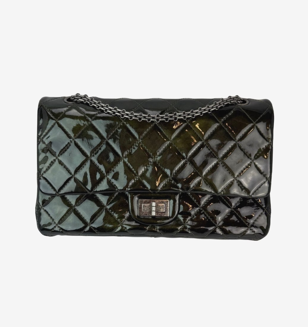 Chanel 2.55 Reissue Iridescent Dark Green Patent Leather Shoulder Bag: Chanel 2.55 Reissue Iridescent Dark Green Patent Leather Shoulder Bag Introducing the Chanel 2.55 Reissue Double Flap Bag, crafted from luxurious dark green patent leather. This medium-sized shoulder 