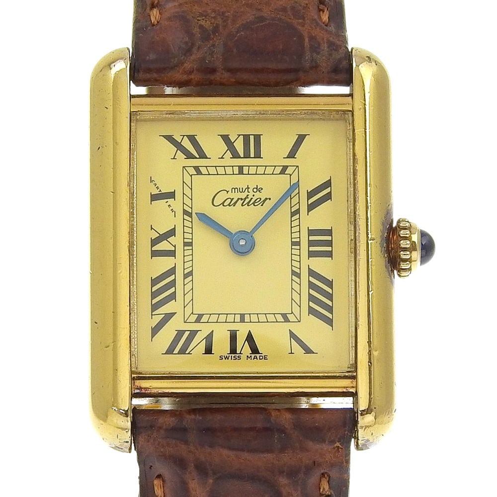 Cartier Ladies Quartz Tank Watch Silver 925 Gold Must SM Cal.057: Cartier Ladies Quartz Tank Watch Silver 925 Gold Must SM Cal.057 This Cartier Must Tank SM wristwatch features a classic analog display and quartz movement. Crafted from 925 silver with gold accents, 