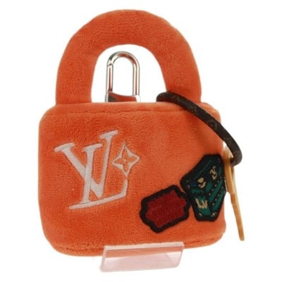 Louis Vuitton M03107 Lucky Rock Fur Bag Charm Orange: Louis Vuitton M03107 Lucky Rock Fur Bag Charm Orange Louis Vuitton Lucky Rock bag charm in orange fur. This Italy-made accessory comes with its dust bag and item box. It is described as being in excel