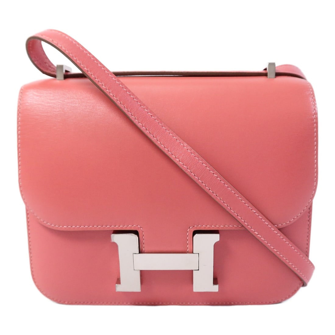 Hermes Constance Mini Pink Tadelakt Leather Shoulder Bag: Hermes Constance Mini Pink Tadelakt Leather Shoulder Bag This Hermes Constance Mini shoulder bag is crafted from luxurious pink calfskin leather, offering a sophisticated and timeless design. The bag 