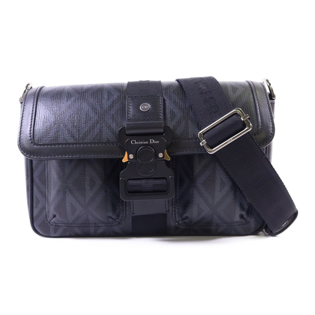 Dior Hit The Road Black PVC Shoulder Bag Silver Hardware: Dior Hit The Road Black PVC Shoulder Bag Silver Hardware This Christian Dior 'Hit The Road' shoulder bag is crafted from durable black PVC coated canvas. Featuring a sleek design, it offers a regular 