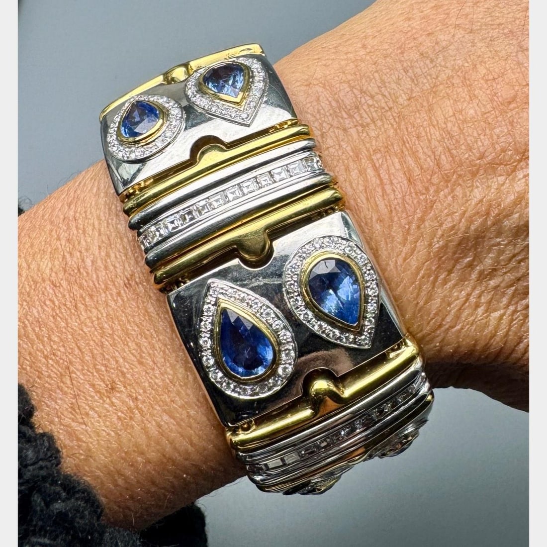 Sapphire Diamond Bracelet in 18K Yellow and White Gold 7.5 Inch: Sapphire Diamond Bracelet in 18K Yellow and White Gold 7.5 Inch This pre-owned bracelet is crafted from 18K yellow and white gold and is set with 12 sapphires totaling approximately 15.00 carats. It a
