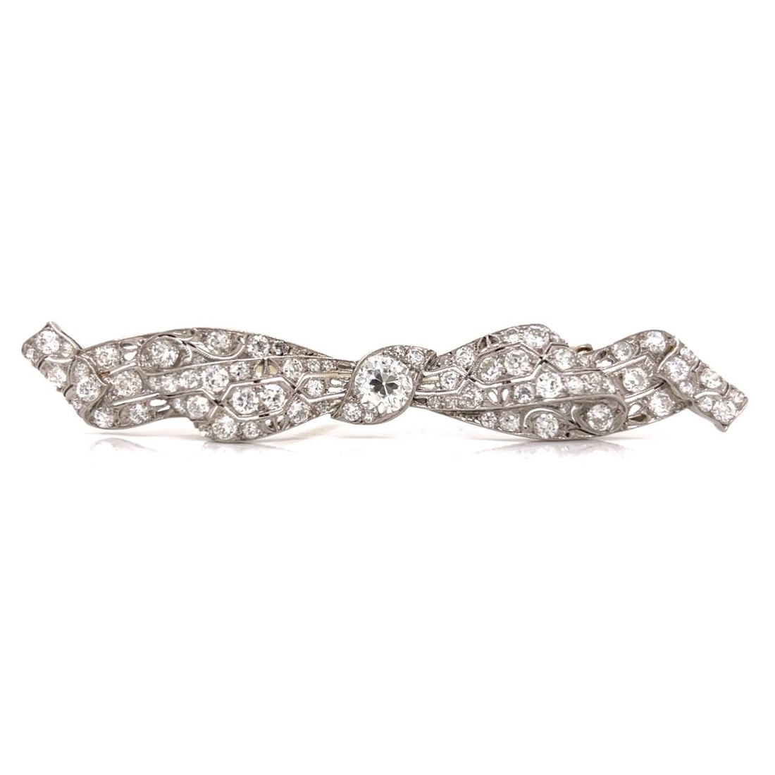 Platinum Art Deco Brooch With 5.20 Carats Diamonds 3.25 Inch: Platinum Art Deco Brooch With 5.20 Carats Diamonds 3.25 Inch This Art Deco brooch is crafted in platinum and features a central diamond of approximately 1.20 carats with I color and VVS clarity. Surro