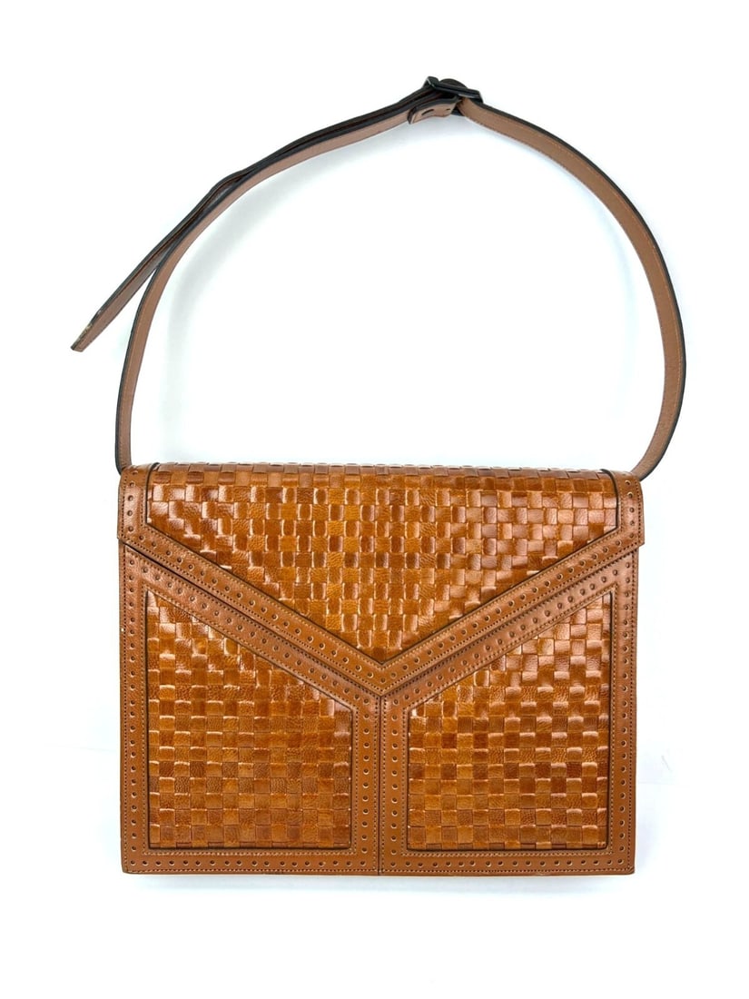 Saint Laurent Brown Woven Leather Shoulder Clutch Bag: Saint Laurent Brown Woven Leather Shoulder Clutch Bag This vintage Yves Saint Laurent shoulder clutch bag features a woven brown leather exterior with a rectangular shape and gold-plated hardware. Des