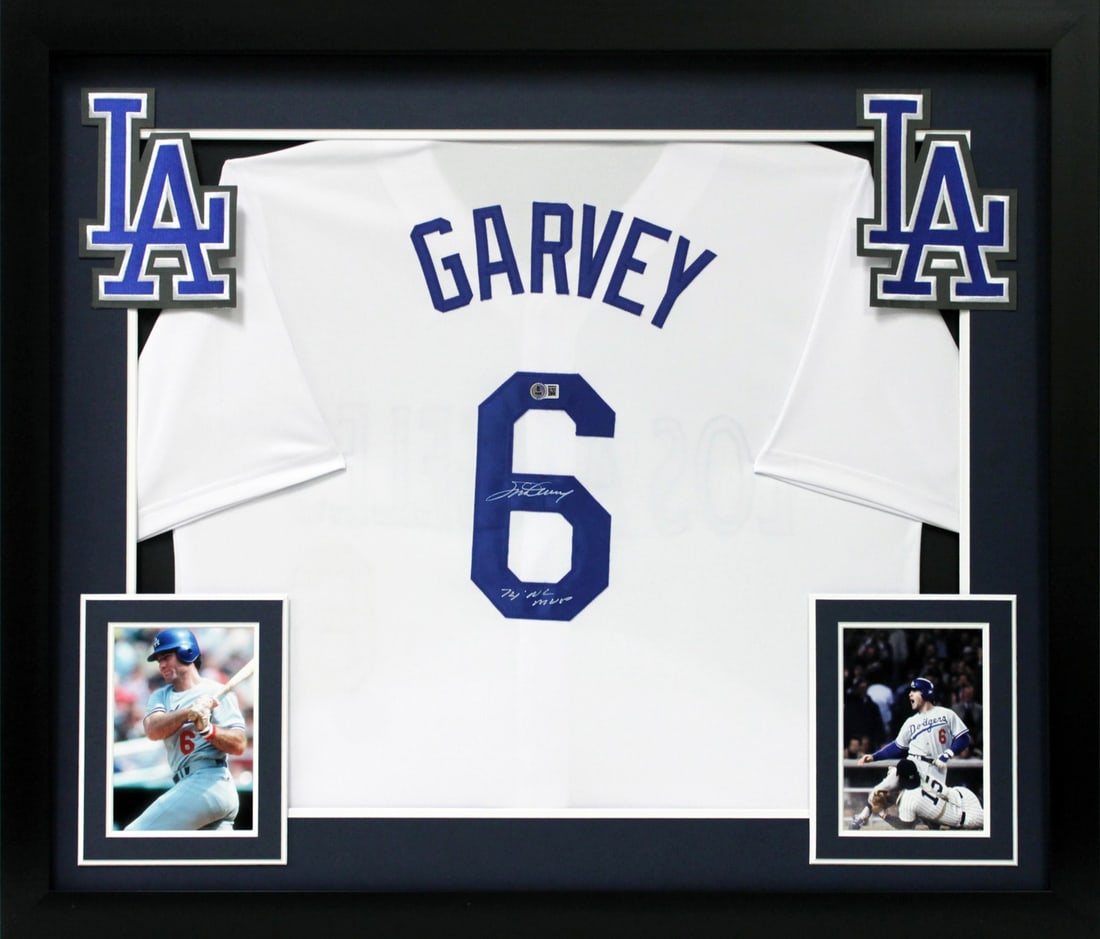 Steve Garvey Signed White Pro Style Framed Jersey 74 NL MVP BAS Authenticated: Steve Garvey Signed White Pro Style Framed Jersey 74 NL MVP BAS Authenticated Celebrate the legacy of baseball with this stunning Steve Garvey "74 NL MVP" Signed White Pro Style Framed Jersey. Persona