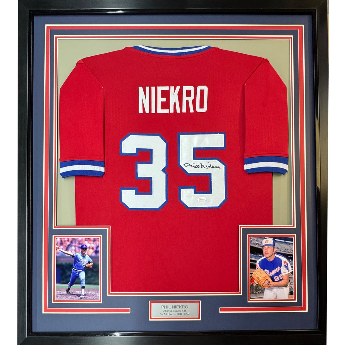 Framed Autographed Phil Niekro Jersey 33x42 Atlanta Braves JSA COA: Framed Autographed Phil Niekro Jersey 33x42 Atlanta Braves JSA COA This professionally framed and matted piece features an autographed jersey of Phil Niekro, a celebrated player from the Atlanta Brave