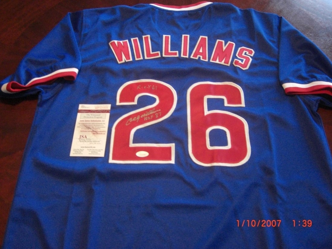 Billy Williams Autographed Chicago Cubs Jersey With JSA COA and HOF Inscription: Billy Williams Autographed Chicago Cubs Jersey With JSA COA and HOF Inscription This pre-owned Chicago Cubs jersey is hand-signed by Billy Williams and features the inscriptions 'HOF 87' and 'ROY 61.'