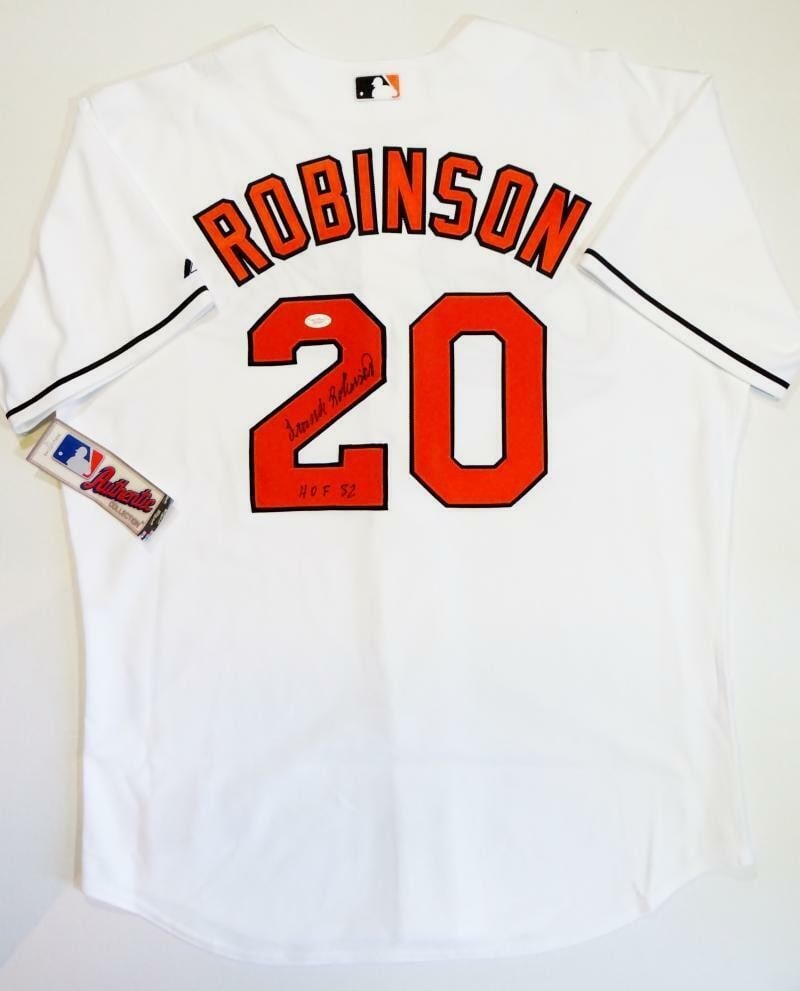 Frank Robinson Autographed Orioles White Majestic Jersey JSA Authenticated: Frank Robinson Autographed Orioles White Majestic Jersey JSA Authenticated This original Baltimore Orioles jersey is a true collectible, signed by the legendary player Frank Robinson. The jersey is ma
