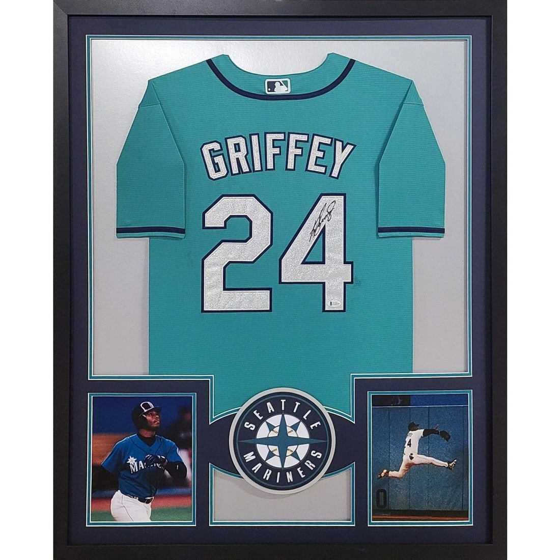 Framed Beckett Autographed Ken Griffey Jr Teal Mariners Jersey: Framed Beckett Autographed Ken Griffey Jr Teal Mariners Jersey This is a framed Seattle Mariners jersey autographed by Ken Griffey Jr. The jersey is authenticated by Beckett and includes a tamper-proo