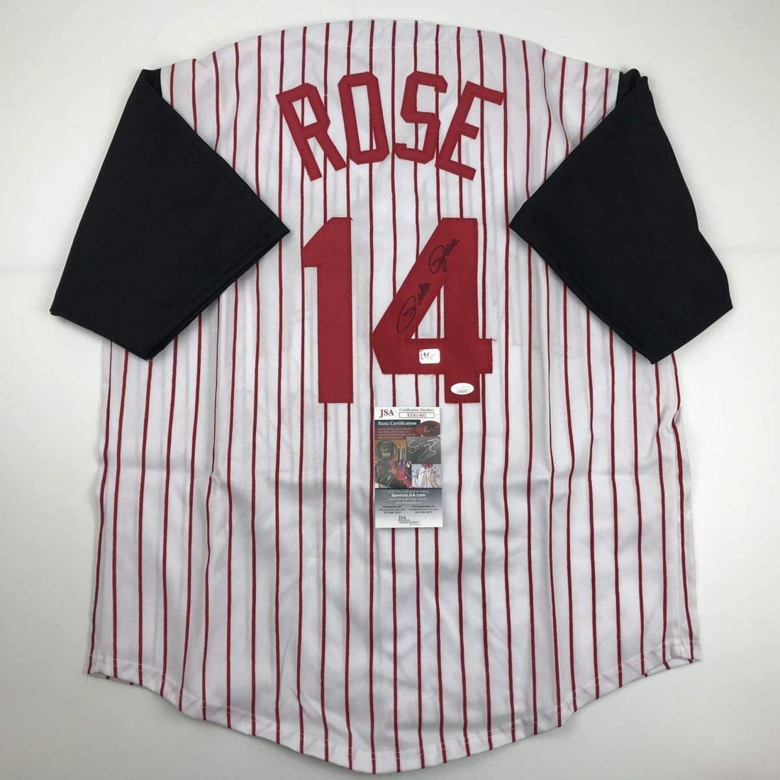 Pete Rose Signed Cincinnati Reds Pinstripe Jersey JSA Certified: Pete Rose Signed Cincinnati Reds Pinstripe Jersey JSA Certified This is an autographed Cincinnati Reds pinstripe baseball jersey signed by the legendary Pete Rose. The jersey is custom-made, featuring