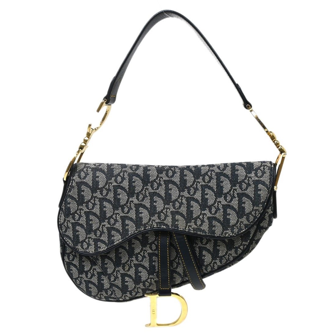 Dior Saddle Shoulder Bag in Navy Trotter Canvas Patent Leather: Dior Saddle Shoulder Bag in Navy Trotter Canvas Patent Leather Christian Dior Trotter Saddle handbag in navy and white canvas with leather trim. This medium shoulder bag features a Velcro closure, a s