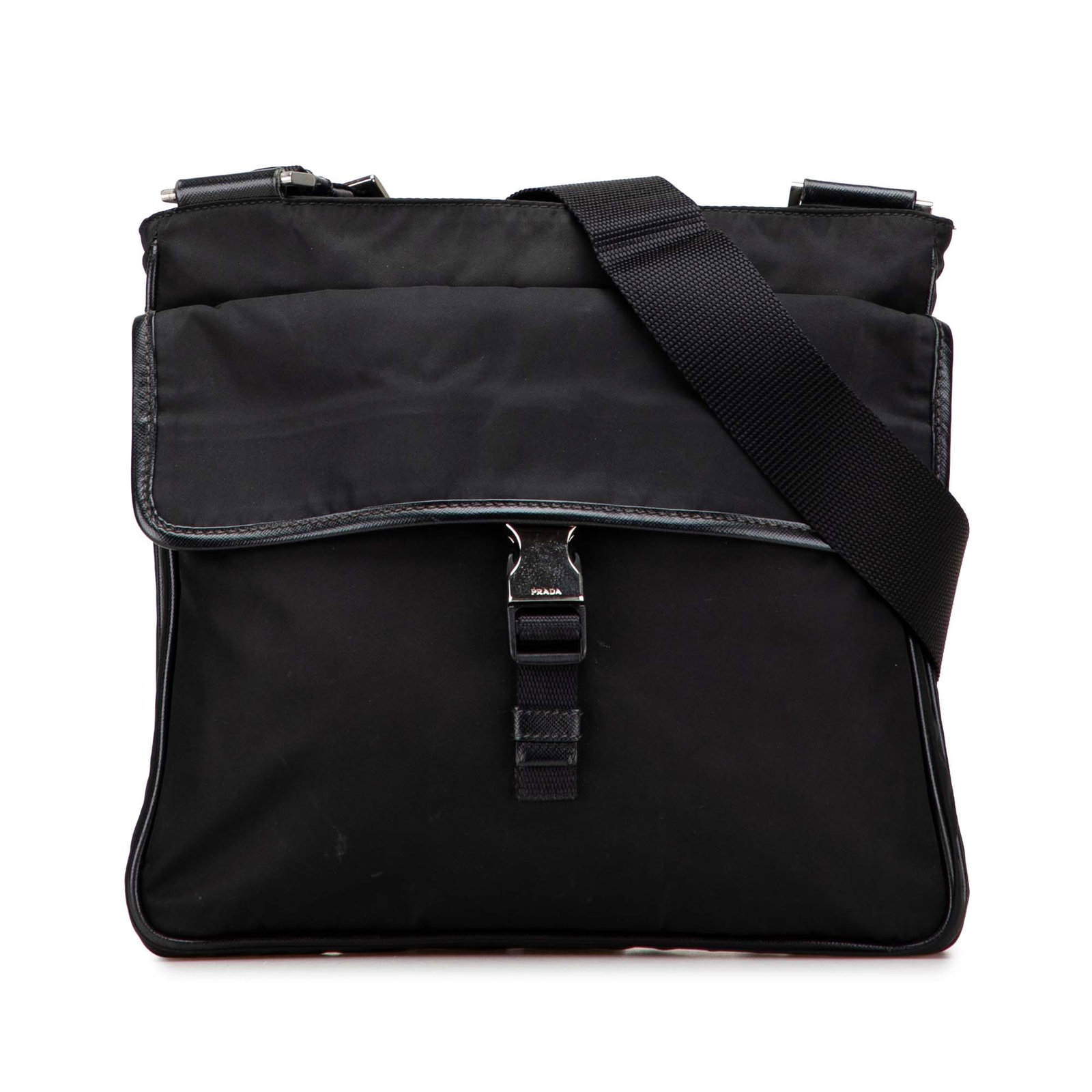 Prada Tessuto Black Nylon Zip Top Crossbody Bag: Prada Tessuto Black Nylon Zip Top Crossbody Bag The Prada Tessuto Zip Top Crossbody is a stylish and functional bag crafted from durable nylon. It features an adjustable flat shoulder strap for comfor