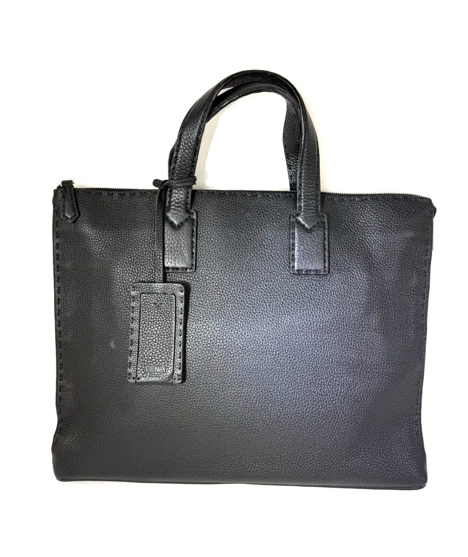 Fendi Selleria Cuoio Romano Black Leather Top Handle Briefcase for Men: Fendi Selleria Cuoio Romano Black Leather Top Handle Briefcase for Men This Fendi Cuoio Romano Selleria briefcase is crafted from black pebbled leather and features a top handle design. The bag includ