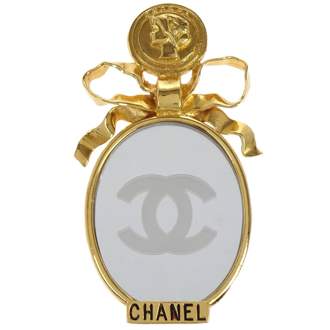 CHANEL Bow Mirror Motif Gold Plated Brooch Pin: CHANEL Bow Mirror Motif Gold Plated Brooch Pin Chanel bow mirror motif brooch pin in gold-plated metal. This brooch features a bow design with mirror motif styling and is presented in good to very goo