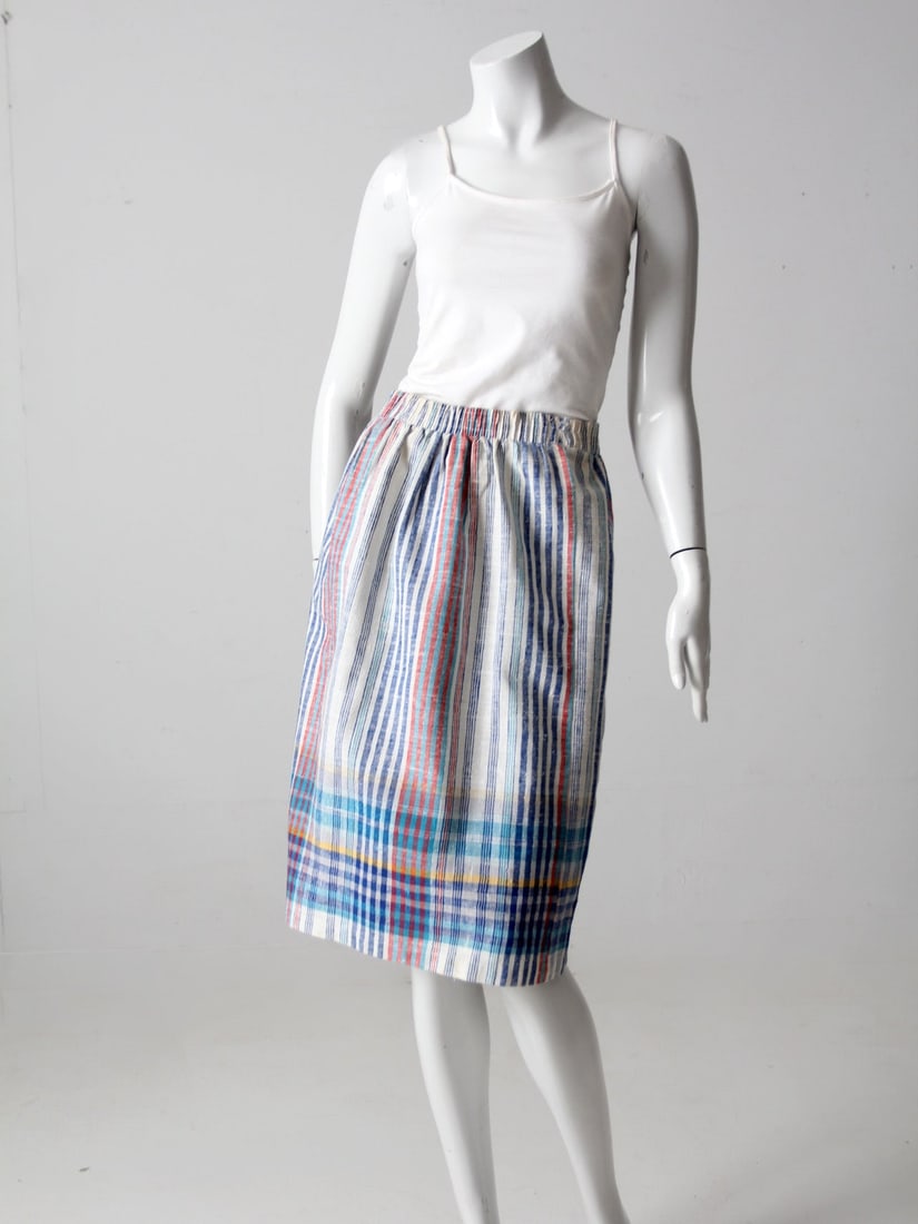 Vintage A-Line Stripe Skirt Blue Red Madras Pattern: Vintage A-Line Stripe Skirt Blue Red Madras Pattern Step out in style with this Vintage Stripe Skirt, featuring a classic A-line silhouette. The skirt showcases a lightweight woven texture adorned wit