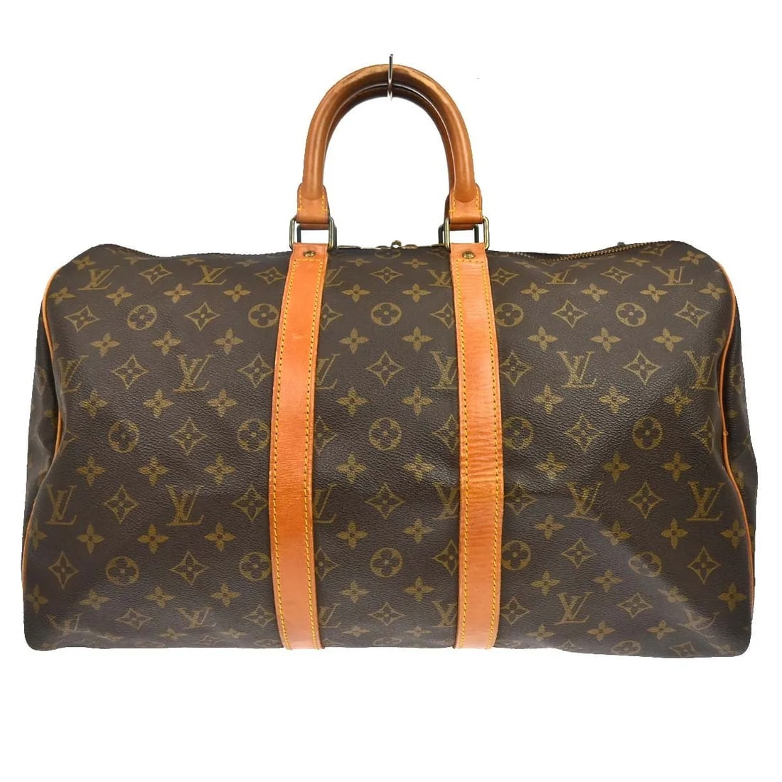 Louis Vuitton Keepall Brown Monogram Canvas Travel Bag: Louis Vuitton Keepall Brown Monogram Canvas Travel Bag Louis Vuitton Keepall in brown monogram canvas. This unisex travel bag is presented in good condition with visible wear. The exterior leather sho