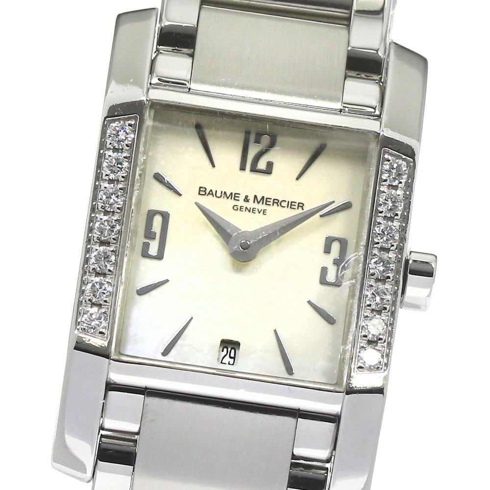 Baume Mercier Diamant Quartz Date Ladies Steel Watch 65516: Baume Mercier Diamant Quartz Date Ladies Steel Watch 65516 This Baume & Mercier Diamant Date Quartz women's wristwatch features a stainless steel case and bracelet with a white shell dial. The watch i