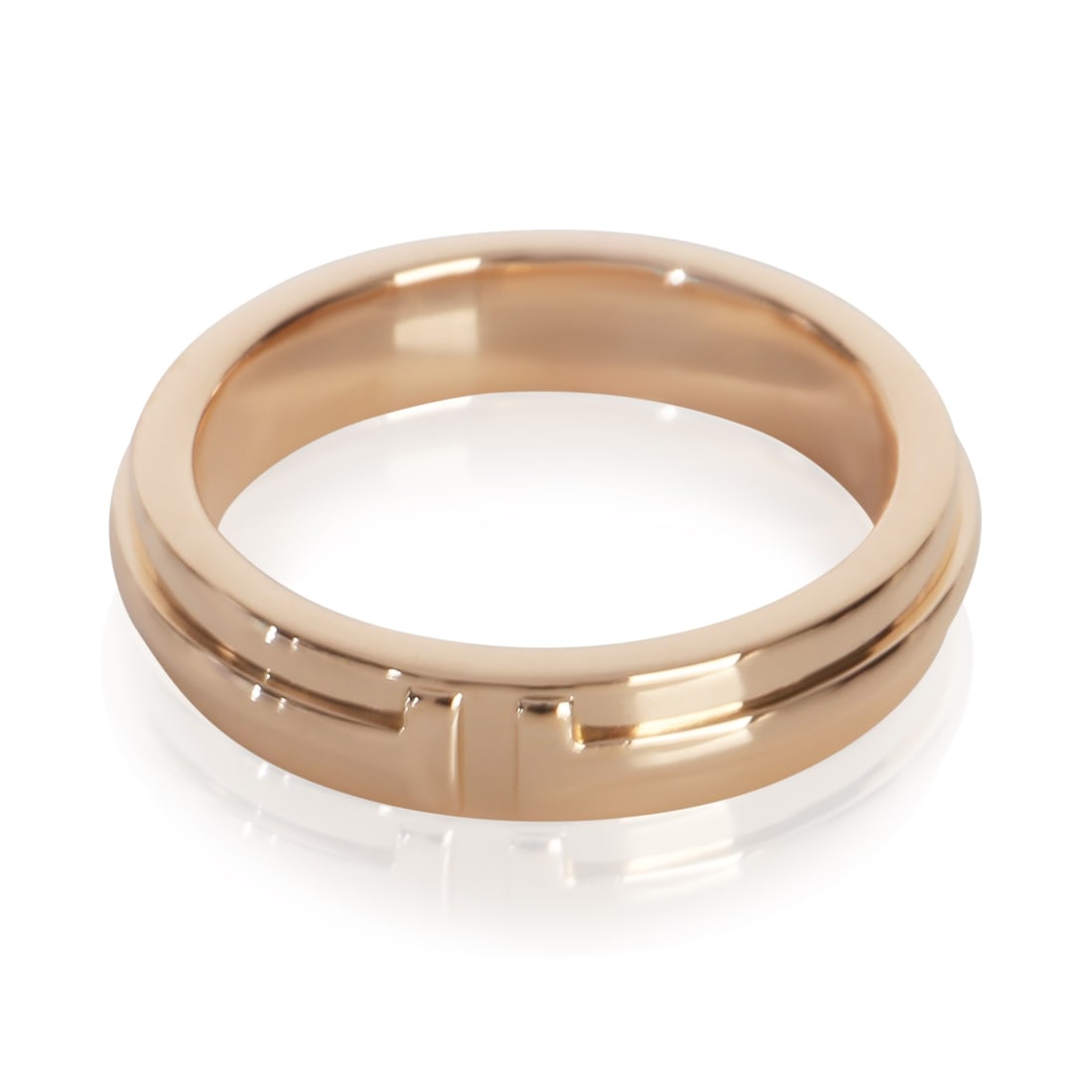 Tiffany T Narrow 18k Rose Gold Ring Size 7: Tiffany T Narrow 18k Rose Gold Ring Size 7 This pre-owned Tiffany & Co. Tiffany T Narrow Ring is crafted from 18k rose gold and features a sleek, minimalist design in a pink hue. The ring is unisex an