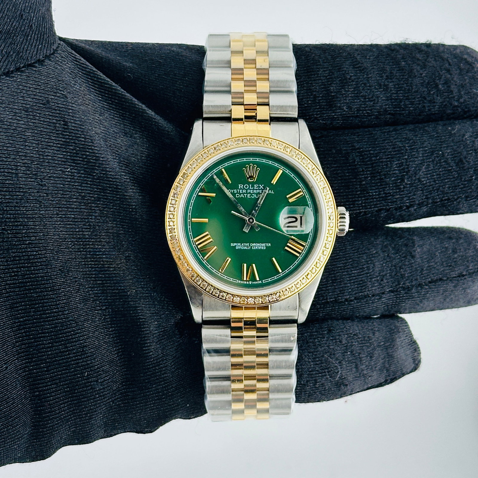Rolex Aftermarket Green Roman Dial Jubilee Bracelet Watch Ref 1601: Rolex Aftermarket Green Roman Dial Jubilee Bracelet Watch Ref 1601 This men's Rolex Datejust features an aftermarket green dial with Roman numerals and stick markers. It includes an aftermarket Jubile