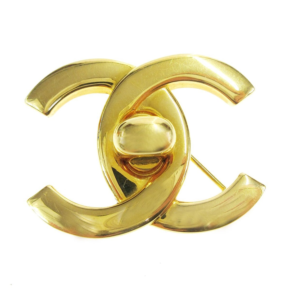 Chanel 96A CC Turnlock Gold Plated Brooch Pin: Chanel 96A CC Turnlock Gold Plated Brooch Pin Large Chanel turnlock brooch pin featuring the CC logo motif in gold-plated metal. Made in France, this piece is marked 96A and comes with its box. Condit
