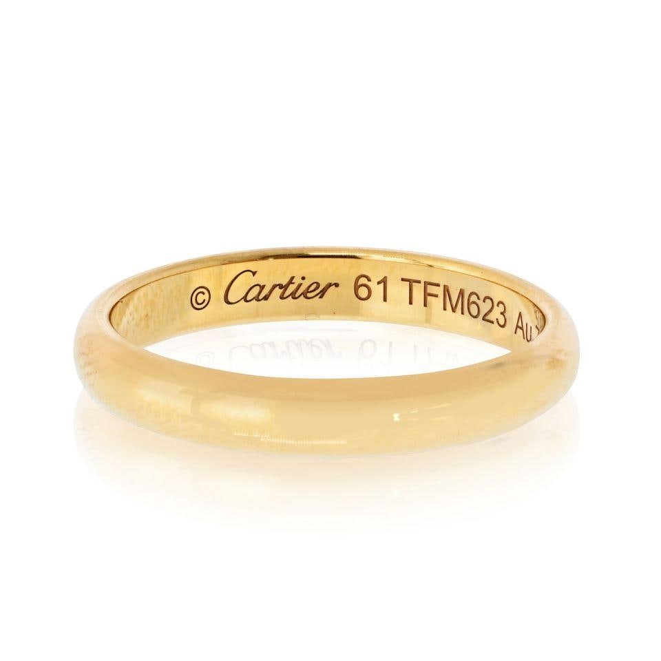 Cartier Classic Dome 18K Yellow Gold Wedding Band EU 61: Cartier Classic Dome 18K Yellow Gold Wedding Band EU 61 This pre-owned Cartier Classic Dome wedding band is crafted from 18K yellow gold and features a timeless design. The band is in excellent condit